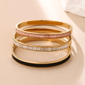 Three-piece set of elegant gold-plated stainless steel bangles with colorful inlay stones