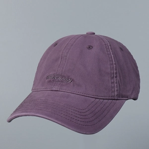 Detailed embroidery of MABENARA text on purple cotton twill baseball cap fabric