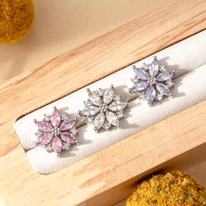 Three flower-shaped titanium steel earrings with pink white and purple zircon stones