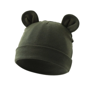Detailed close-up of a dark green baby knit hat with cute round bear ears and ribbed hem