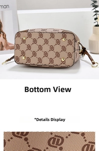 Close-up of monogram canvas handbag bottom featuring four gold metal protective studs