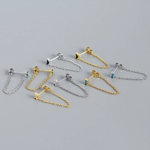 Detailed view of s925 silver tassel earrings with colorful zircons in gold and silver