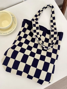 Knitted checkerboard tote bag in navy and cream white with wide shoulder straps