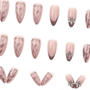 Gothic style press-on nails set with nude base, brown patterns and silver metal crosses