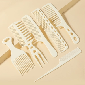 Close-up of a 6-piece professional beige styling hair comb set for various hair textures
