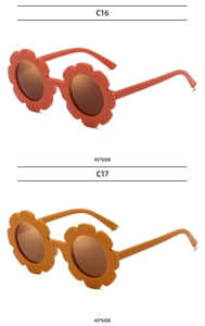 Detail view of flower-shaped kids' sunglasses in orange and yellow at a 45-degree angle