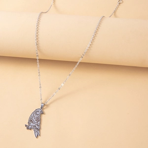 Vintage stainless steel raven pendant necklace with engraved moon and stars pattern