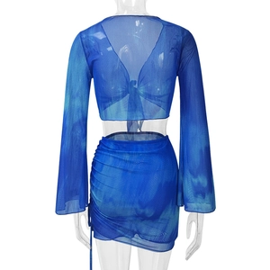 Detail of blue tie-dye mesh crop top with lace-up back and flared sleeves back view
