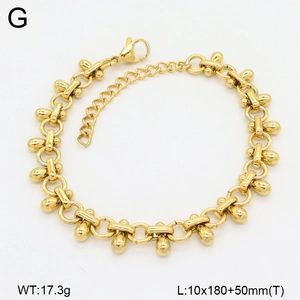 Detailed view of golden double-layer chain bracelet with water drop links and lobster clasp