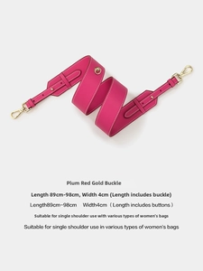 Detail of adjustable plum shoulder strap with gold hardware and white stitching, 4cm wide