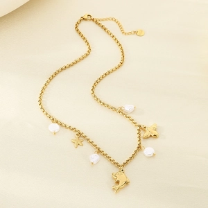 Close-up of gold stainless steel necklace with dolphin, starfish and pearl charms
