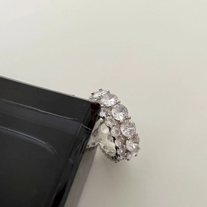 Close-up of S925 sterling silver ring featuring double-row pave set brilliant cubic zirconia