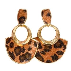 Minimalist leopard print heart fan earrings with golden metal studs on white background
