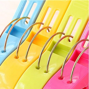 Strong windproof plastic clothes pegs in blue, yellow, green and pink with metal springs