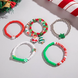 Detailed close-up of handmade Christmas beaded bracelets with Santa and tree charms