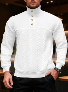 Detail of white cable knit sweater featuring a stand-up collar and elegant gold buttons