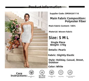 Detail view of white strapless mini dress with pearl embellishments and 100% polyester fabric