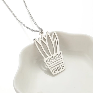 Minimalist silver potted plant pendant necklace in stainless steel with a cutout design