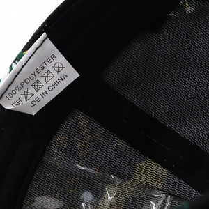Detail of internal black mesh cap featuring 100% polyester fabric and washing label