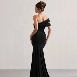 Detail of elegant black off-shoulder evening dress with fishtail hem and slim fit