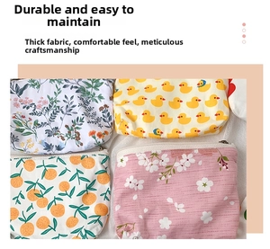 Detail of floral printed fabric mini pouches with durable zippers and canvas texture