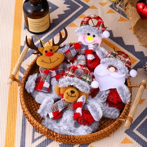 Set of four plush Christmas ornaments featuring Santa and reindeer in a rustic tray