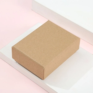 Rectangle kraft paper gift box on white stand for jewelry and small accessories