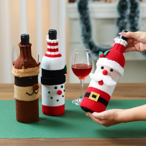 Three-piece knitted Christmas wine bottle covers with Santa, snowman and elk designs