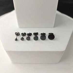 Set of black stainless steel stud earrings in sizes from 3mm to 8mm on display