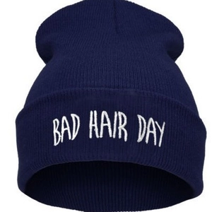 Dark blue ribbed knit beanie with white Bad Hair Day embroidery on the folded cuff
