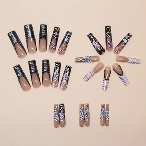 Detailed view of Y2K style black and purple press-on nails with star and zebra patterns