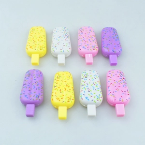 Flat lay view of eight colorful miniature ice cream shaped DIY accessories in 4 pastel colors