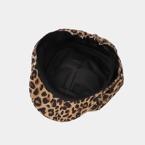 Fashionable leopard print newsboy cap with black lining and adjustable inner size tag