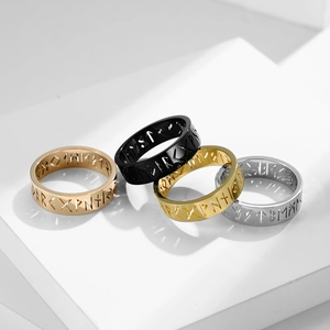 Set of Nordic Viking rune rings in rose gold, black, gold, and silver stainless steel