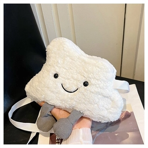Close-up of white plush cloud-shaped crossbody bag with embroidered face and grey corduroy feet