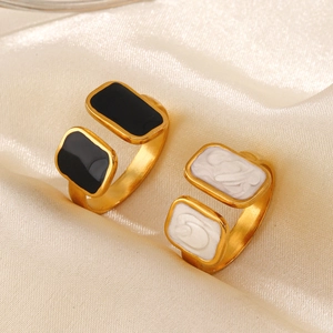 French vintage gold square enamel open rings in black and white on silk fabric