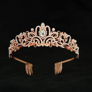 Detail of rose gold bridal crown with clear rhinestones and integrated hair combs