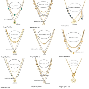 Multi-layer gold plated stainless steel necklaces with sun, heart, and pearl pendants