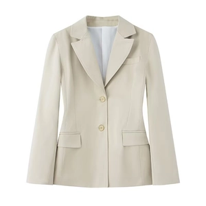 Detailed flat lay of a beige slim fit women blazer with shoulder pads and twin buttons