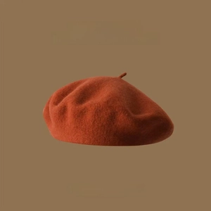 Detail of wool beret in caramel brown showing premium fabric texture and vintage design