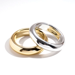 Minimalist geometric round thick rings in polished gold and silver metal finishes