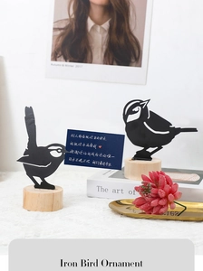 Modern black iron bird card holder with wooden base for stylish garden and desk decor