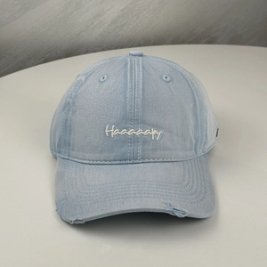 Distressed light blue cotton baseball cap with Haaaaapy embroidery and wide curved brim
