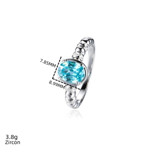 Macro shot of S925 silver ring with 8.99mm oval neon blue zircon and side stone details