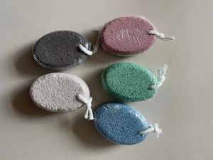 Detail of five multi-colored oval lava pumice stones with white hanging cords