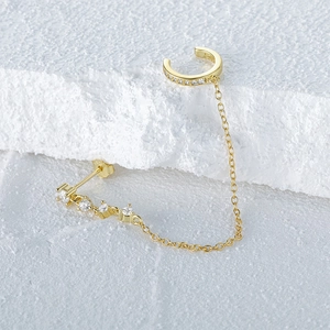 Detailed view of S925 sterling silver gold ear cuff with chain and studded bar earring
