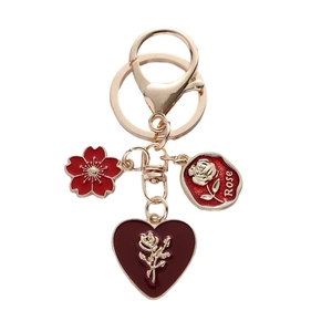 Red rose heart charm keychain with floral oil-drip pendants and gold alloy finish