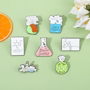 Set of seven science enamel pins featuring fun chemical formulas and turtle on green background