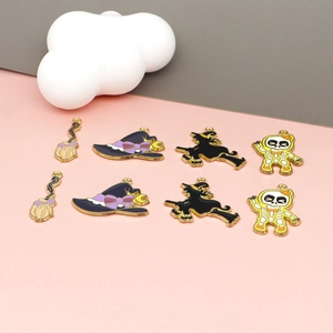 Detail of assorted Halloween enamel charms including witch hats and skulls for jewelry DIY