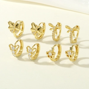 Set of four pairs of 18K gold-plated bow and butterfly earrings with sparkling cubic zirconia